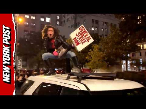 NYC Protester Jumps on Cop Car as Anti-ICE Demonstrators Take to the Streets