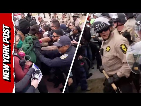 ‘They’re Hitting us With F–king Sticks’: Police Scuffle with Protestors Outside ICE Facility