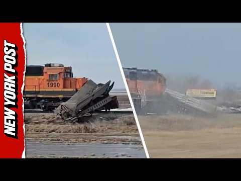 Driver Shocked When Freight Train Obliterates Stalled Trailer, Dragging it Along the Tracks