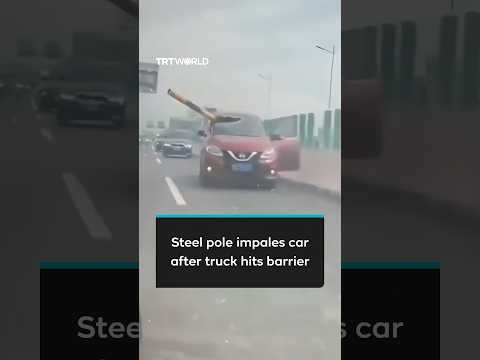 Steel pole impales car after truck crashes through height barrier