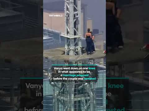Russian couple climbs Empire State Building to call for peace