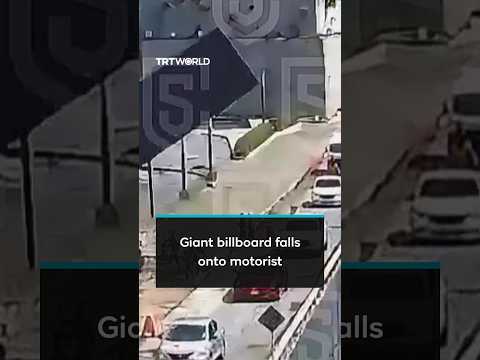 Giant billboard collapses onto road, killing motorist