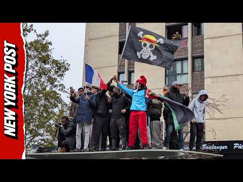 French Protesters Climb on Top of Bus Stop and Demand Macron’s Resignation